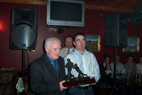 Eamon Toye (right) receives the Senior Player of the Year award from Joe Jordan