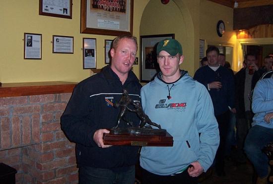 Eamon Robinson receives the Senior Player of the Year award from Brendan Tierney 