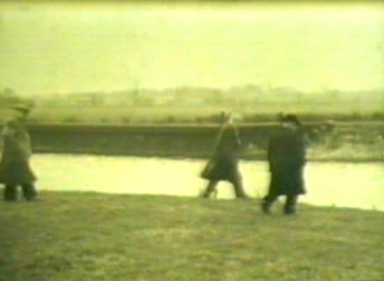 Fr. William McKnight and Aloysius Mackle survey the land.