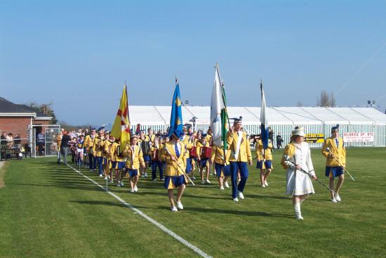 St. John's Band, Portadown lead Maghery youth players in a parade before the game.