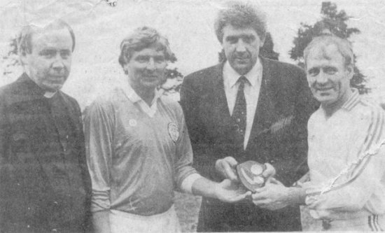 Gerry Mellon Moy pictured with the team captains Kevin Rafferty, Armagh, Patsy Forbes, Tyrone and with Rev Fr McGinley CC Maghery